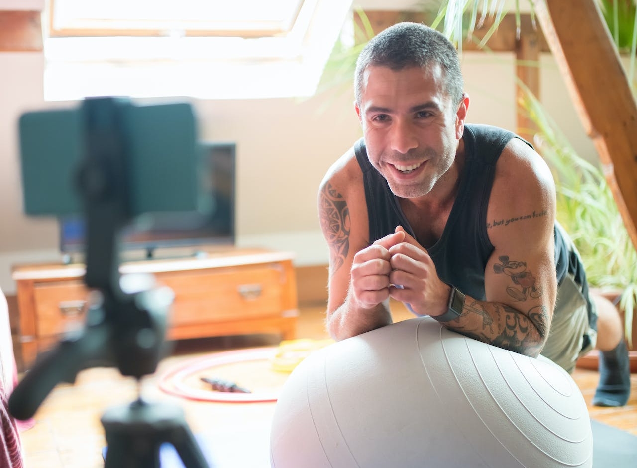 Man Leaning on a Exercise Ball