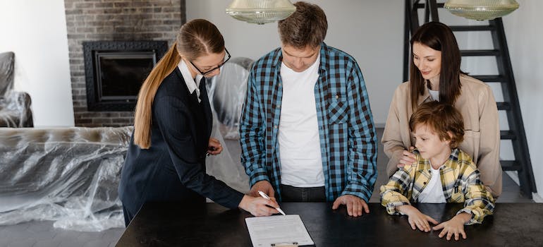 A Man Signing a Paper