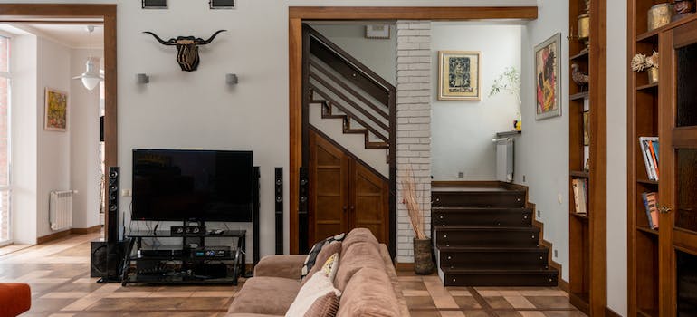 Spacious living room with storage space under the staircase
