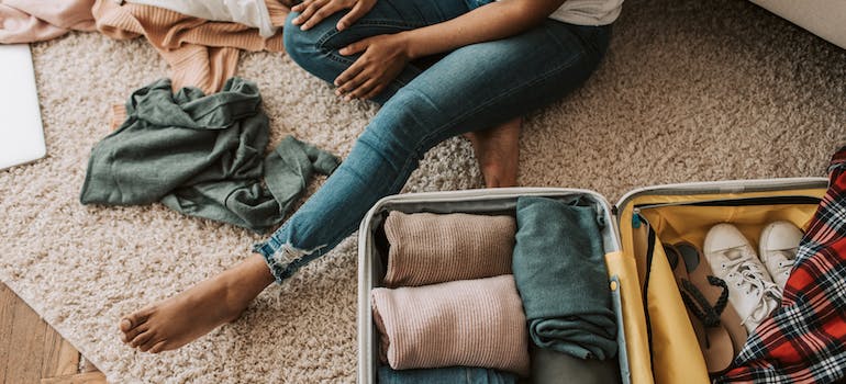 A woman shows how to make use of household items when packing