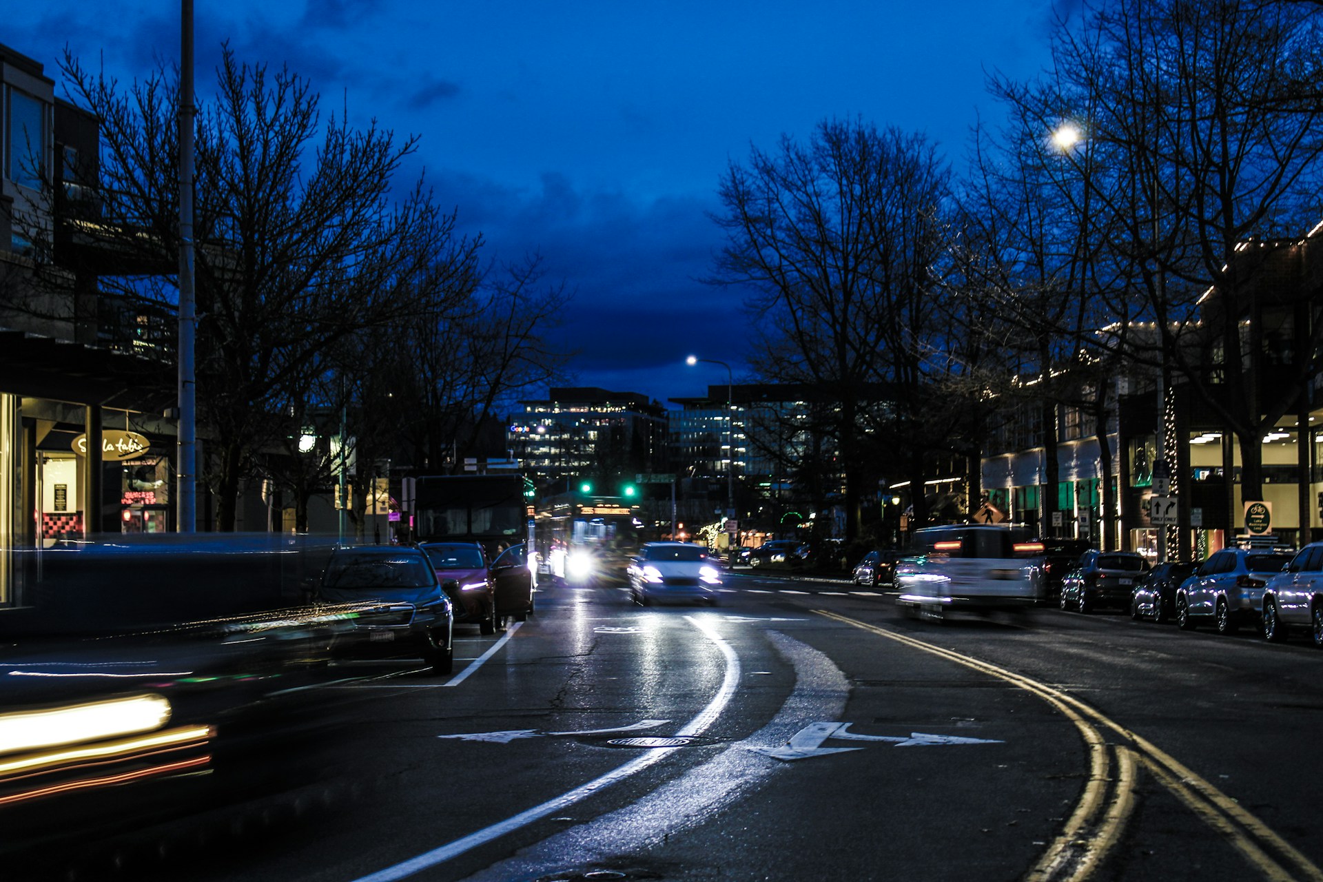 Downtown Kirkland WA street filled with lots of traffic at night