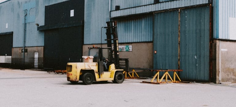 A Forklift near Warehouse