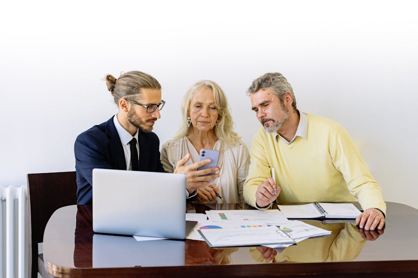 Man and Woman Sitting at the Table with a property manager.