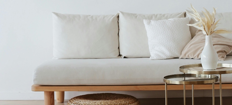 White Couch on Wooden Floor