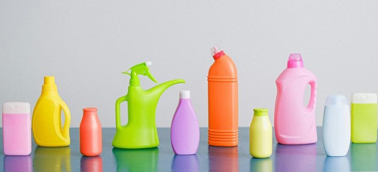 Assorted vibrant bottles lined up in a row, showcasing a variety of colors and sizes