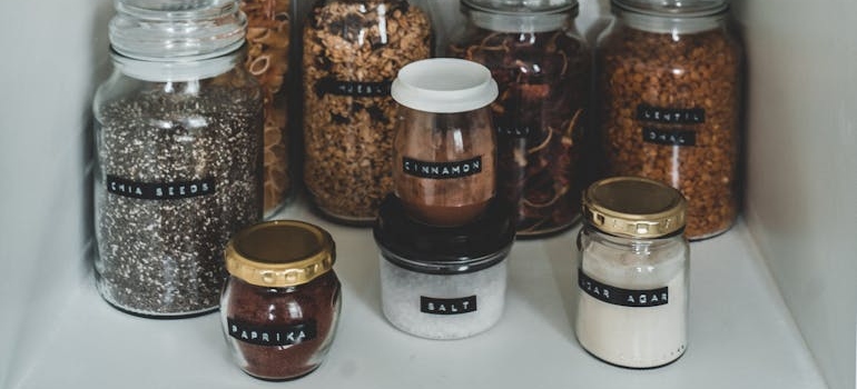 Clear glass jars with various spices