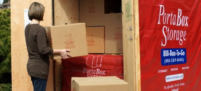 Woman loading an Everett self-storage PortaBox container